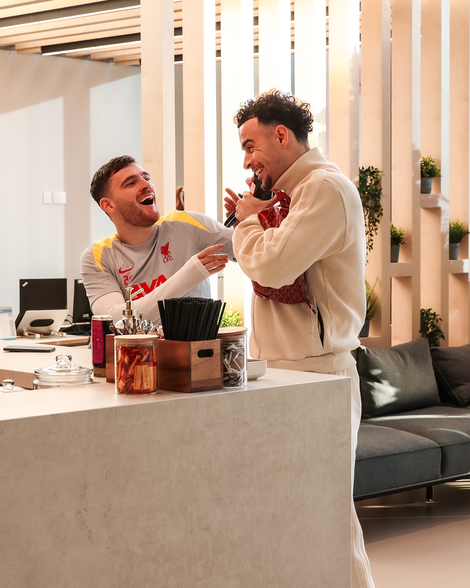 Liverpool stars beam as they joke around in coffee dock ahead of Real Madrid clash